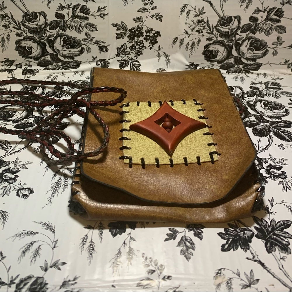 Leather side cross bag with rope strap